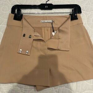 Size 4 Alice and Olivia almond colored shorts.